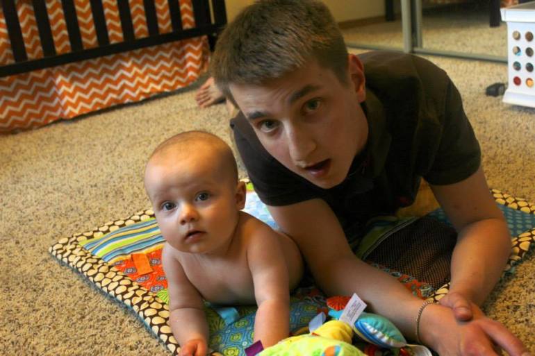 Daddy and son having tummy time